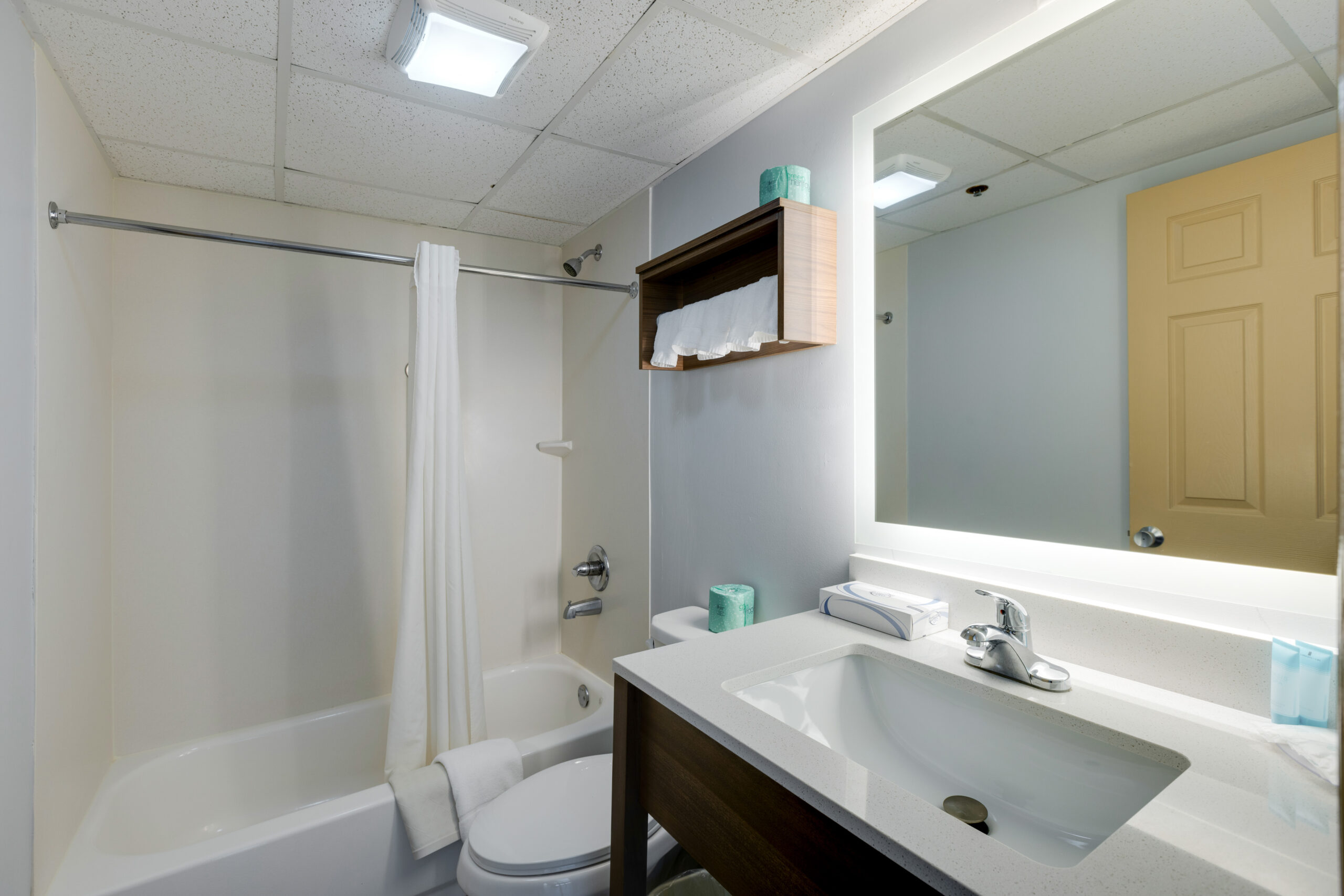 bathroom vanity in double room with kitchenette at Park Grove Inn