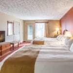 A beautiful room with two beds at the Park Grove Inn in Pigeon Forge.