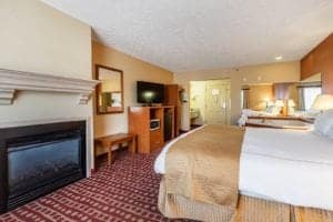 Jacuzzi suite with king bed and fireplace at Park Grove Inn Pigeon Forge TN