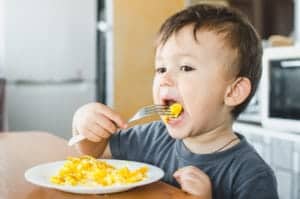 kid-eating-continental-breakfast