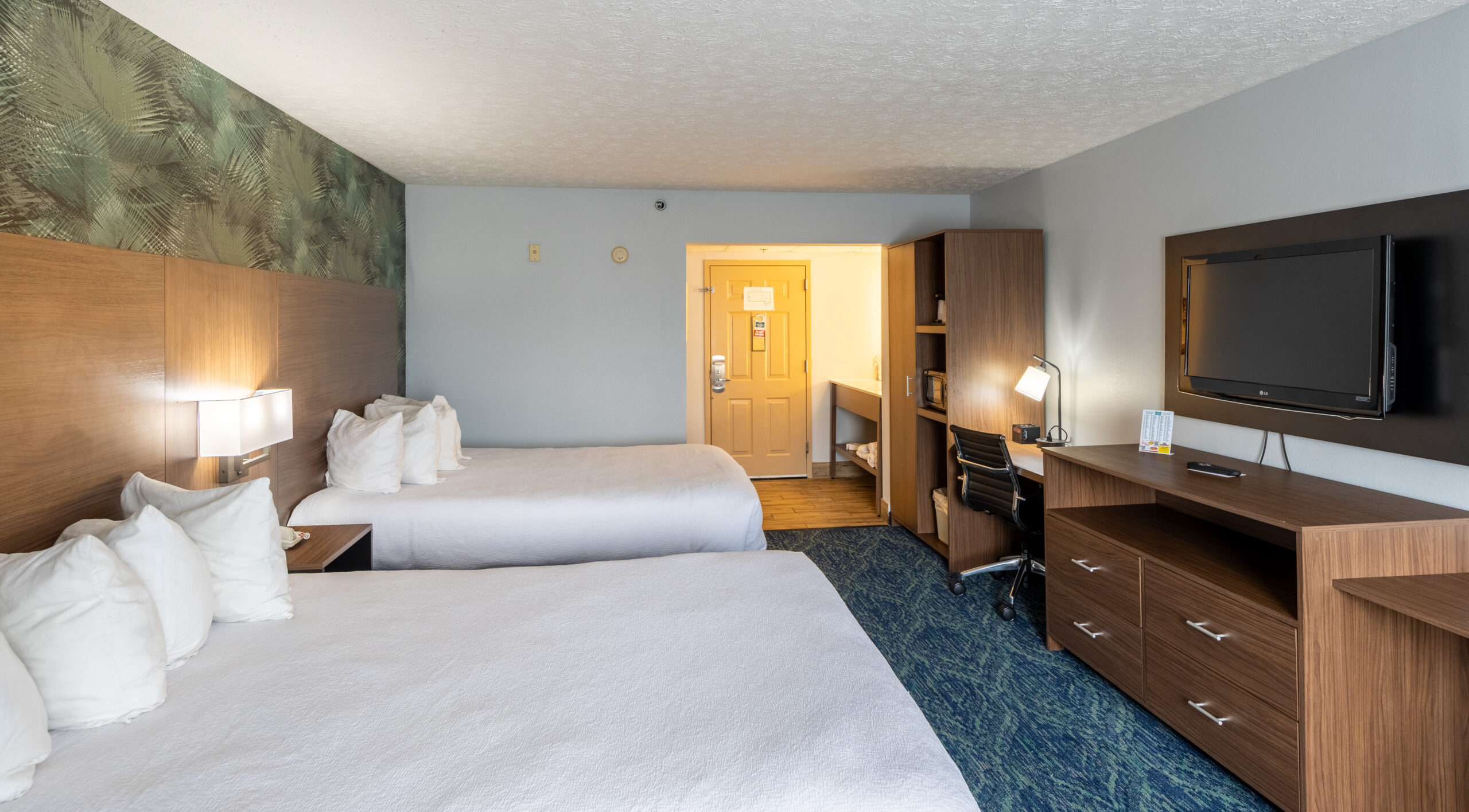 spacious hotel room with two queen beds at Park Grove Inn Pigeon Forge